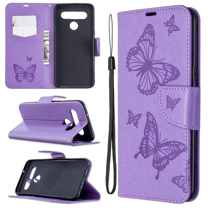 Purple phone wallet case with butterfly emboss, flip stand, card slot, wrist strap.