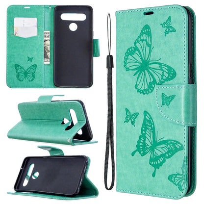 Teal phone wallet case with butterfly emboss, flip stand, card slot, wrist strap.