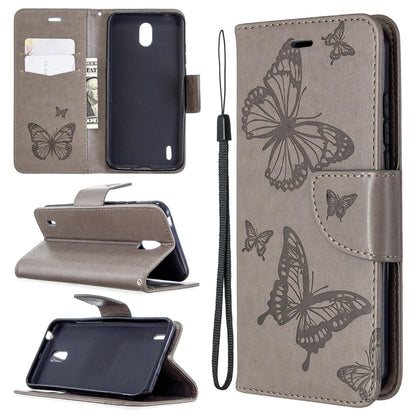 Taupe phone wallet case with butterfly emboss, flip stand, card slot, wrist strap.
