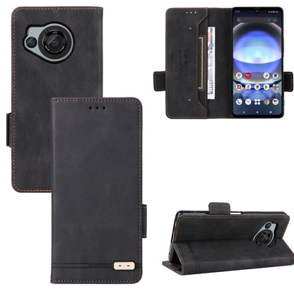Charcoal black leather flip phone case with magnetic clasp, card slots, and camera cutout