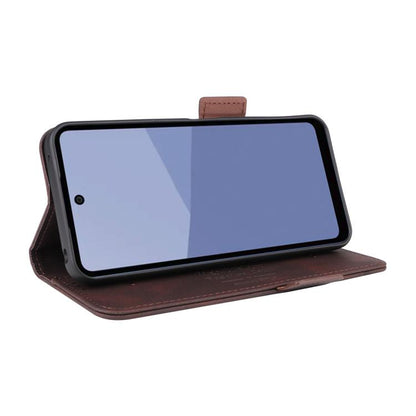 Brown leather flip phone case folded into a viewing stand