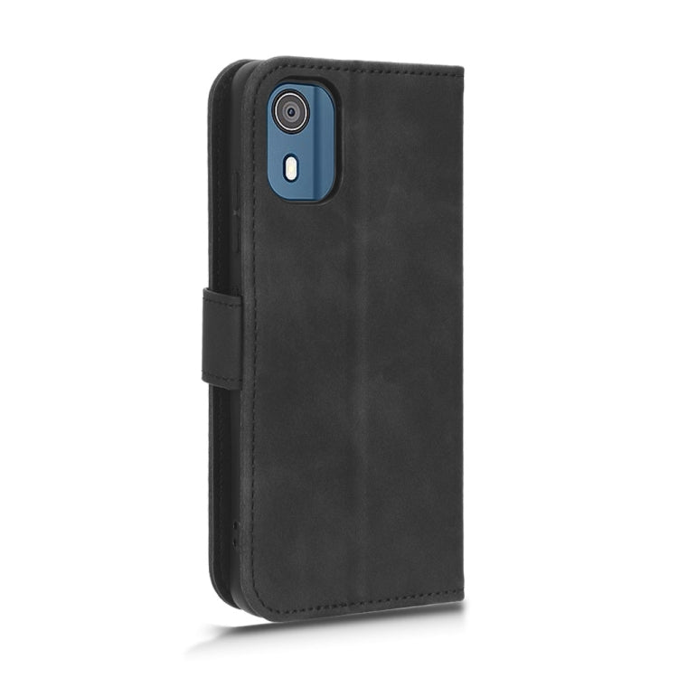 Black magnetic flip leather phone case with camera cutout and secure strap