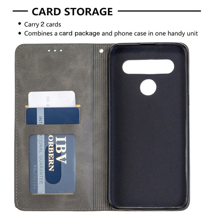 Grey wallet phone case with card storage slots and flip cover over the phone