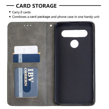 Grey wallet phone case with card storage slots and flip cover over the phone
