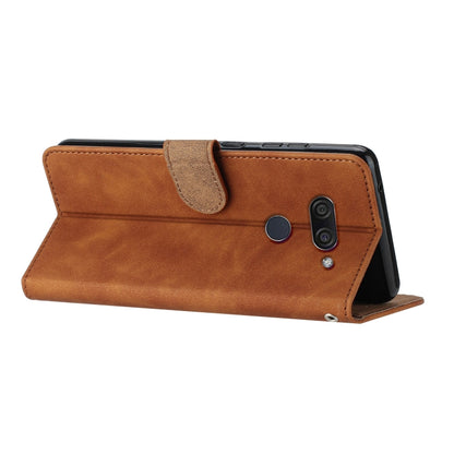 Brown folio-style phone case with embossed butterfly detailing and side camera opening.