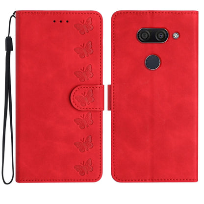 Red embossed leather phone case with butterfly pattern, flip cover and wrist strap.