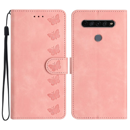Pink embossed leather phone case with butterfly pattern, flip cover and wrist strap.