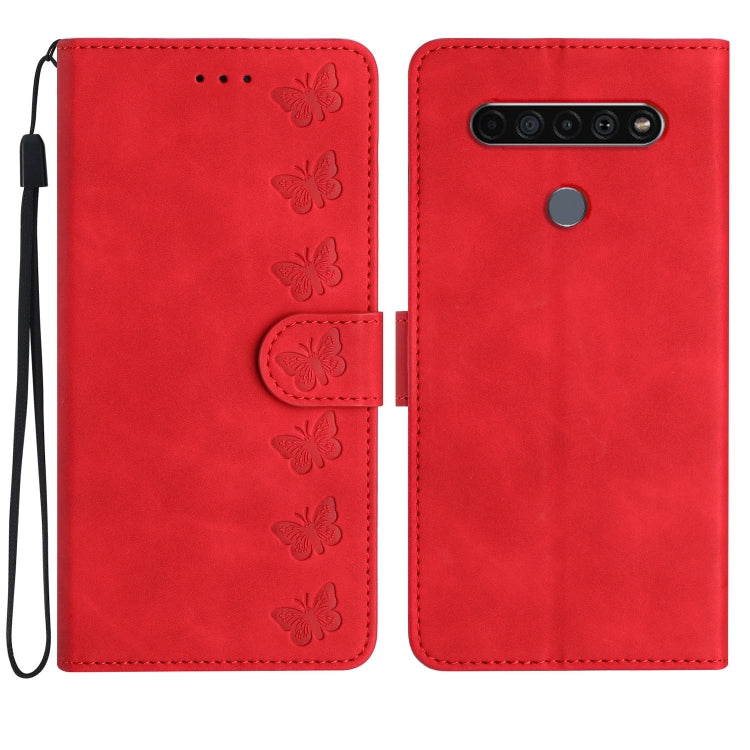Red leather phone case with embossed butterflies, flip cover, and wrist strap.