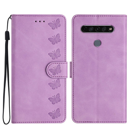 Purple leather phone case with embossed butterflies, flip cover and wrist strap.