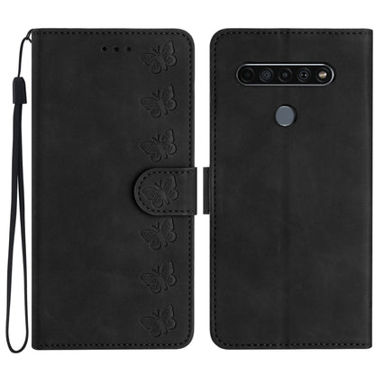Black leather phone case with embossed butterflies, flip cover and wrist strap.