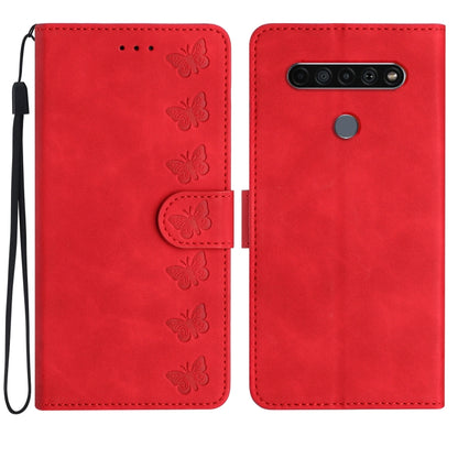Red embossed leather phone case with butterfly embossing and flip cover opening.