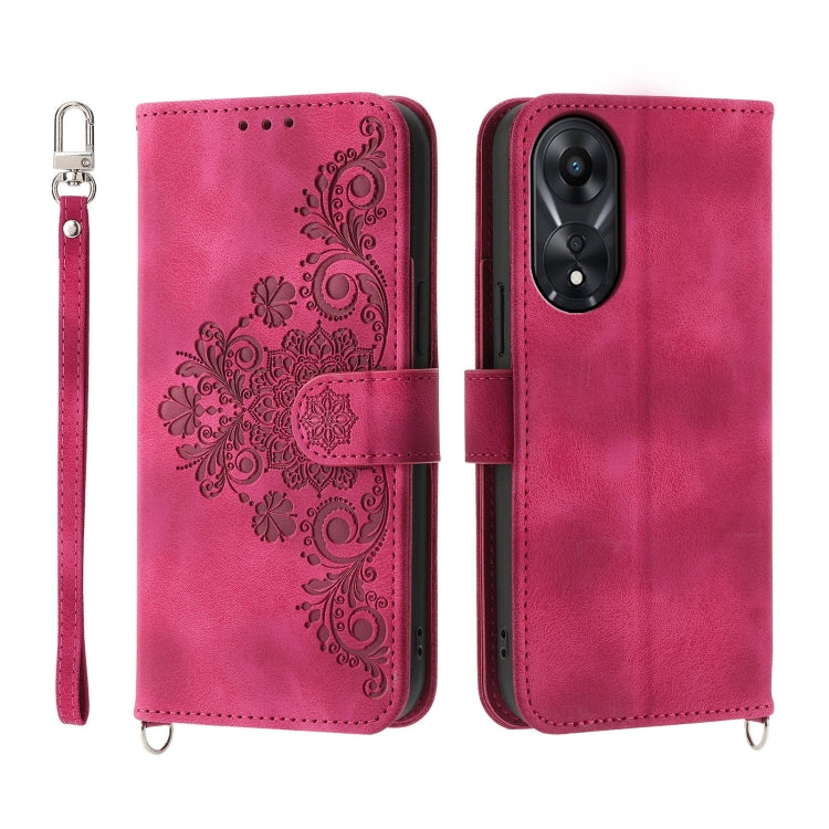 Hot pink embossed floral wallet phone case with flip cover and wrist strap.