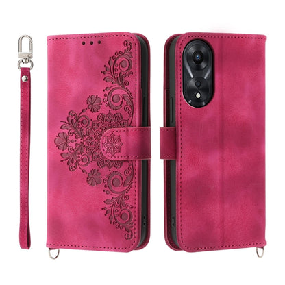 Hot pink embossed floral wallet phone case with flip cover and wrist strap.