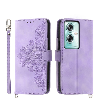 Purple leather phone wallet case with embossed floral design, camera cutout, strap