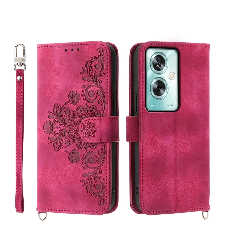 Magenta leather phone wallet case with embossed floral design, camera cutout, strap