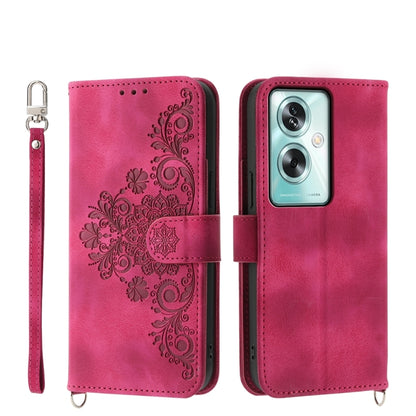 Magenta leather phone wallet case with embossed floral design, camera cutout, strap