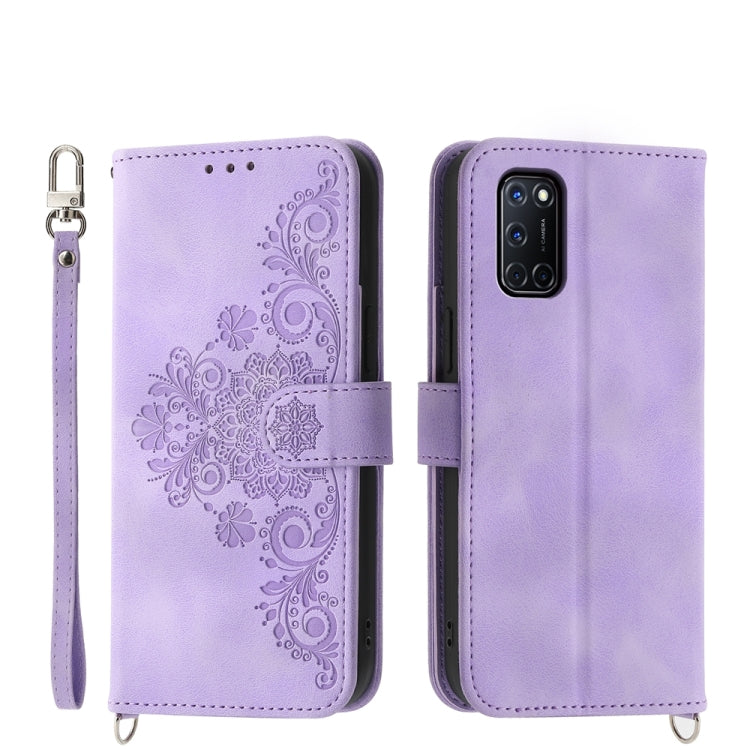 Purple leather phone wallet case with embossed floral design and wrist strap