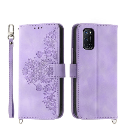 Purple leather phone wallet case with embossed floral design and wrist strap