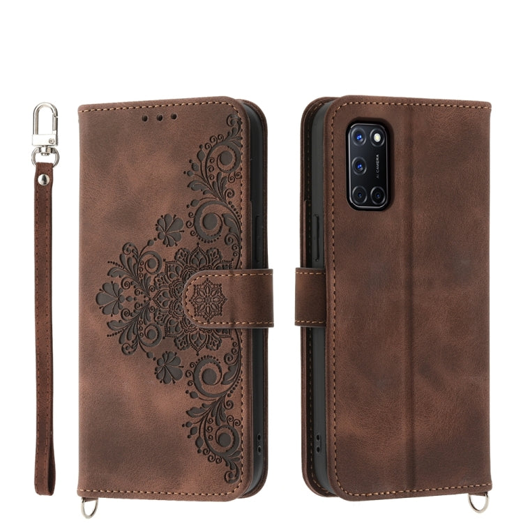 Brown leather phone wallet case with embossed floral design and wrist strap