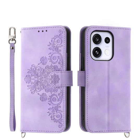 Purple leather wallet phone case with embossed floral design and wrist strap.