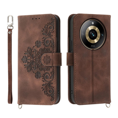 Brown embossed floral leather wallet phone case with wrist strap and flip cover