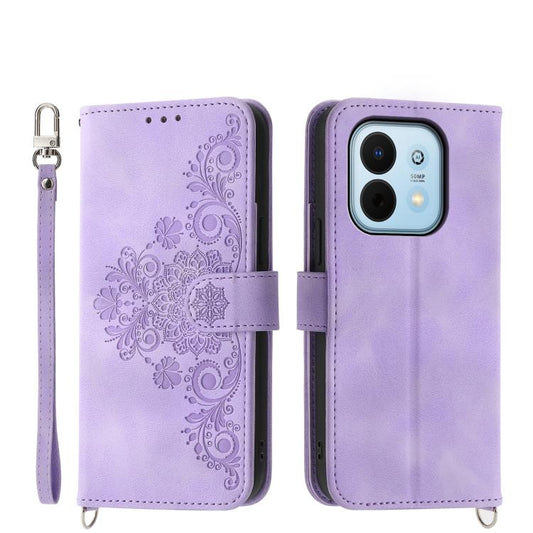 Purple embossed floral leather wallet phone case with wrist strap and magnetic closure