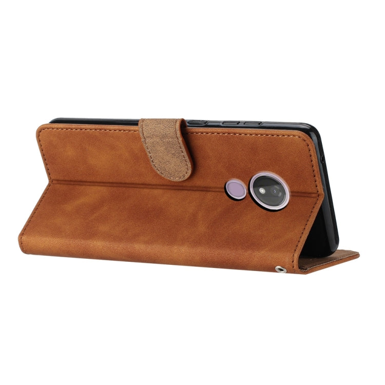 Brown leather wallet phone case with foldable stand and camera cutout