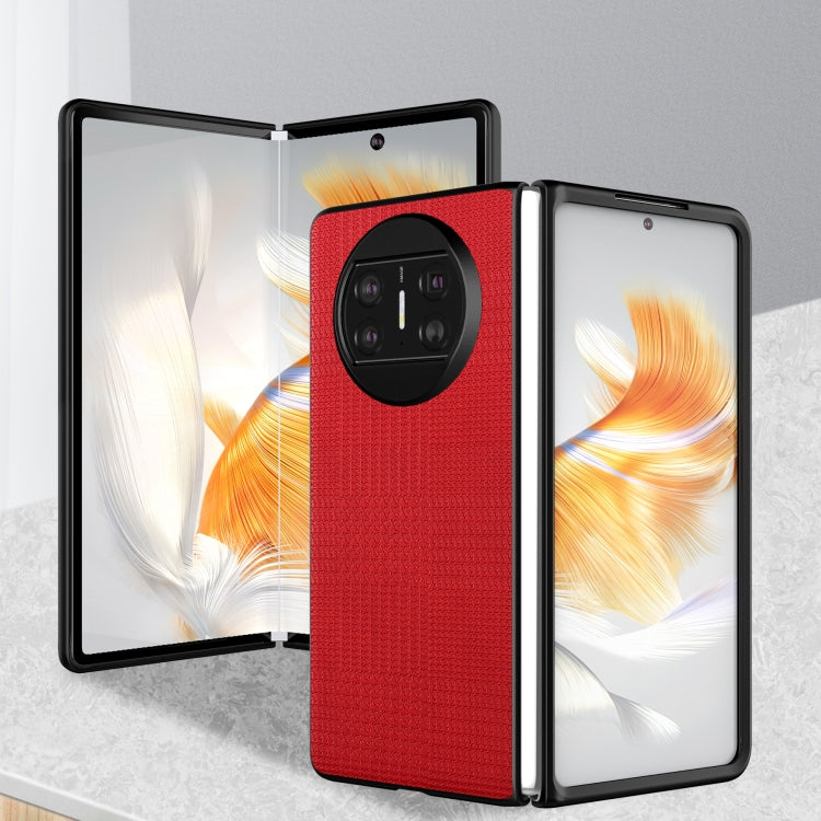 Red shockproof phone case with textured finish and raised quad camera cover