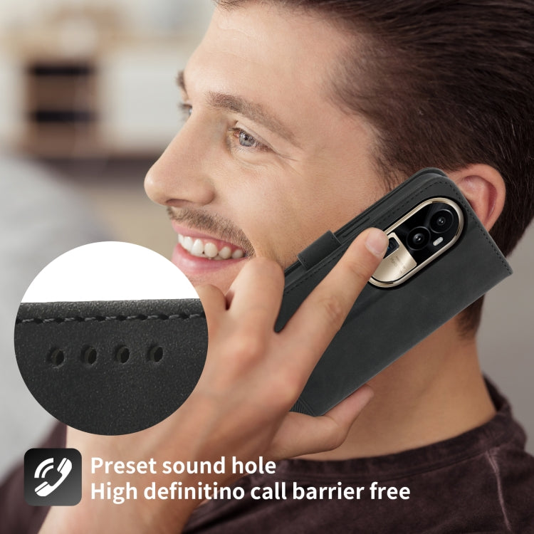 Black folio phone case with speaker sound hole cutout and wrist grip.