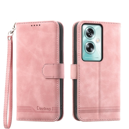 Pink suede-style flip phone case with wrist strap and camera cutout