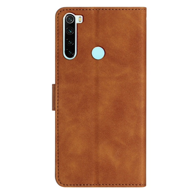Brown embossed leather phone case with butterfly design, camera cutout, and finger slot
