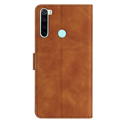 Brown embossed leather phone case with butterfly design, camera cutout, and finger slot
