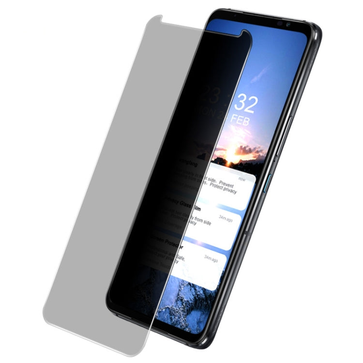 Anti-spy tempered glass screen protector film angled on smartphone screen