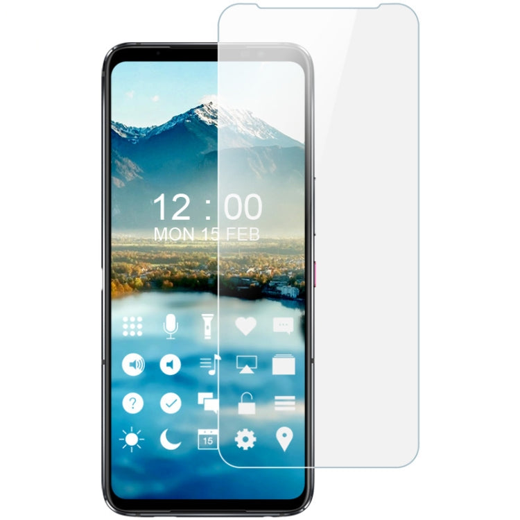 Smartphone front with clear soft screen protector film aligned over the display