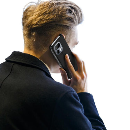 Black flip leather phone case on a hand-held phone with camera cutout