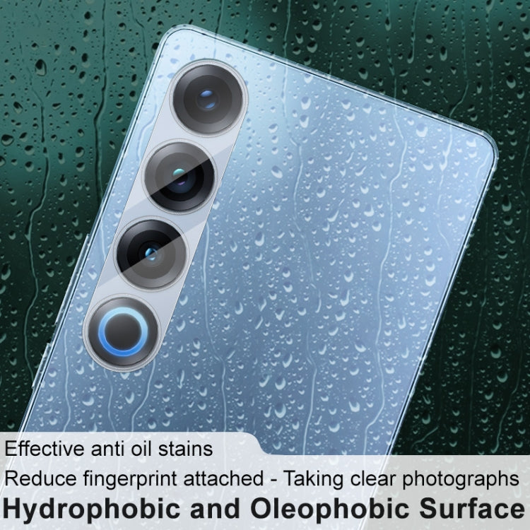 Hydrophobic anti-oil rear camera lens film on phone back with water droplets visible