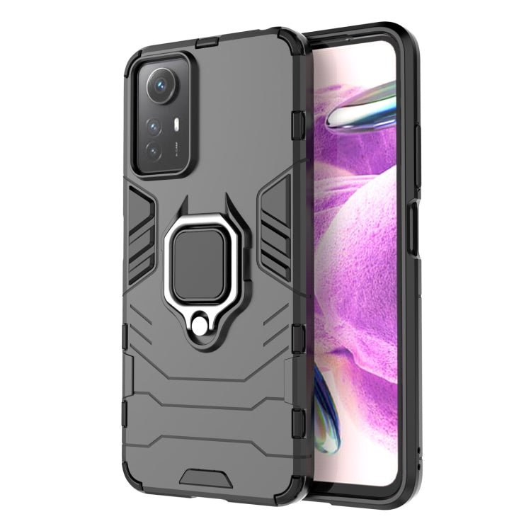 Magnetic ring phone case with rugged armor design, dark gray/black color.