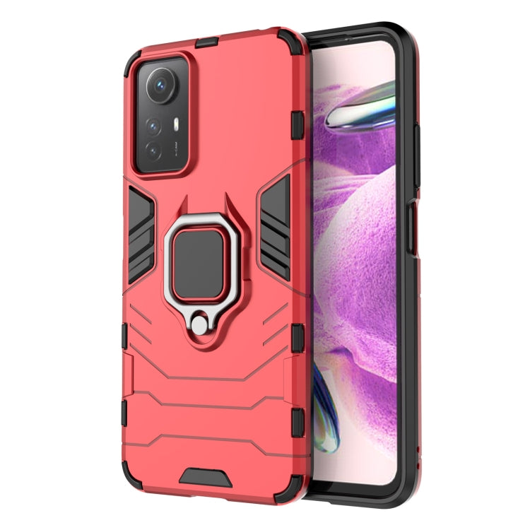 Magnetic ring phone case with rugged armor design, red color with raised ring holder.