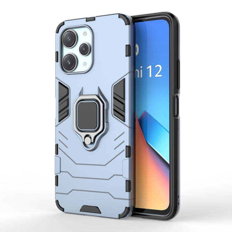 Rugged magnetic ring phone case, light blue back and dark edges with camera cutouts.
