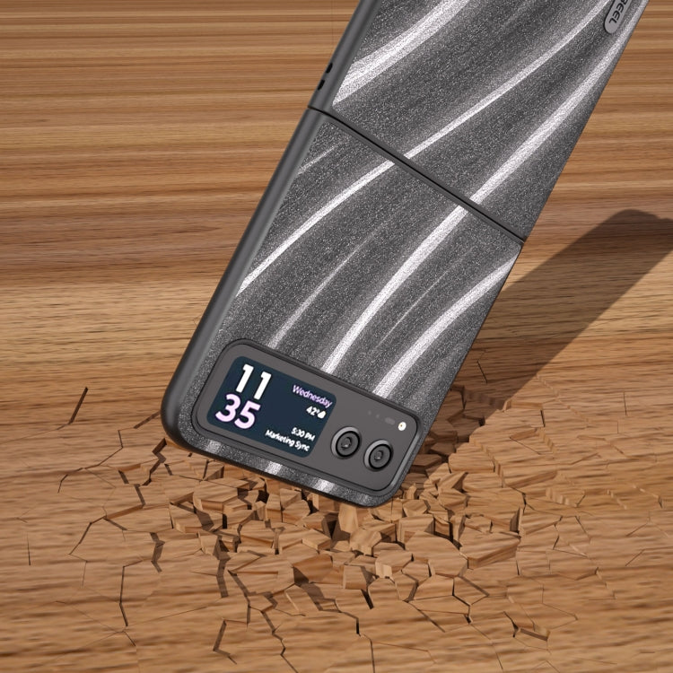Protective phone case with dark gray wavy stripe pattern shown near debris