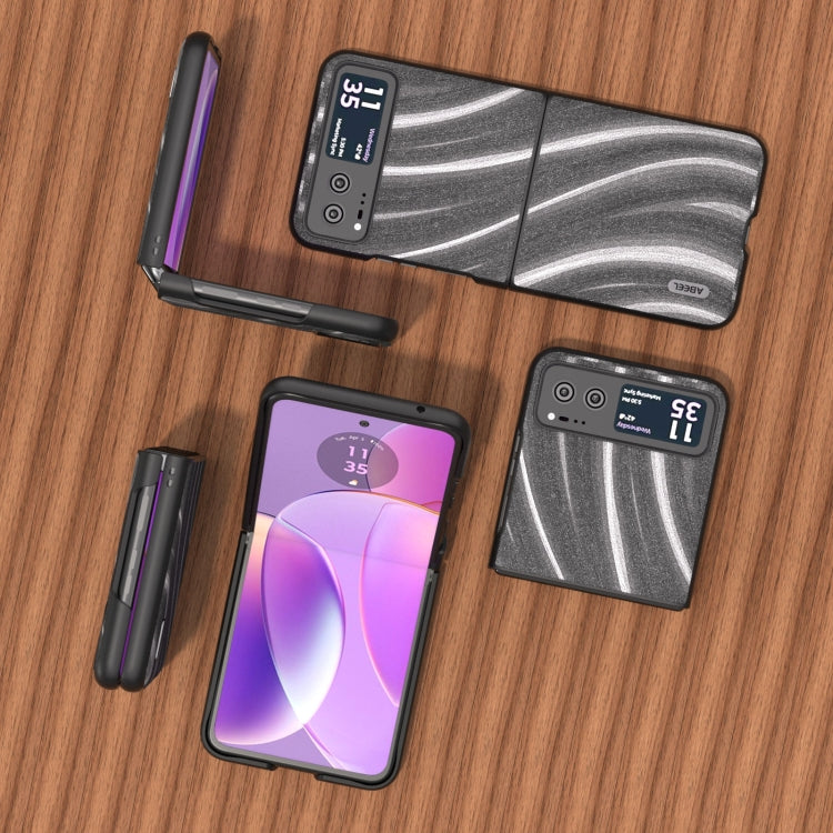 Protective phone case with dark gray wavy stripe design and matching accessory