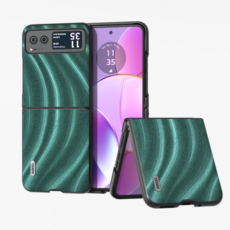 Protective foldable phone case with teal spiral pattern, shown open with front cover