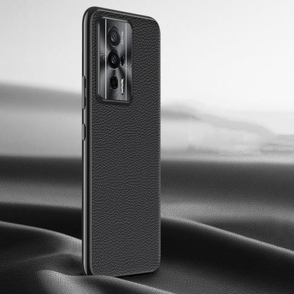 Black litchi-texture genuine leather phone case, back view with camera window.