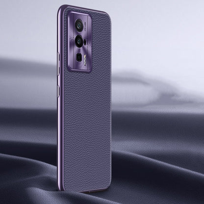Purple litchi-texture genuine leather phone case with camera cutout, side angle.