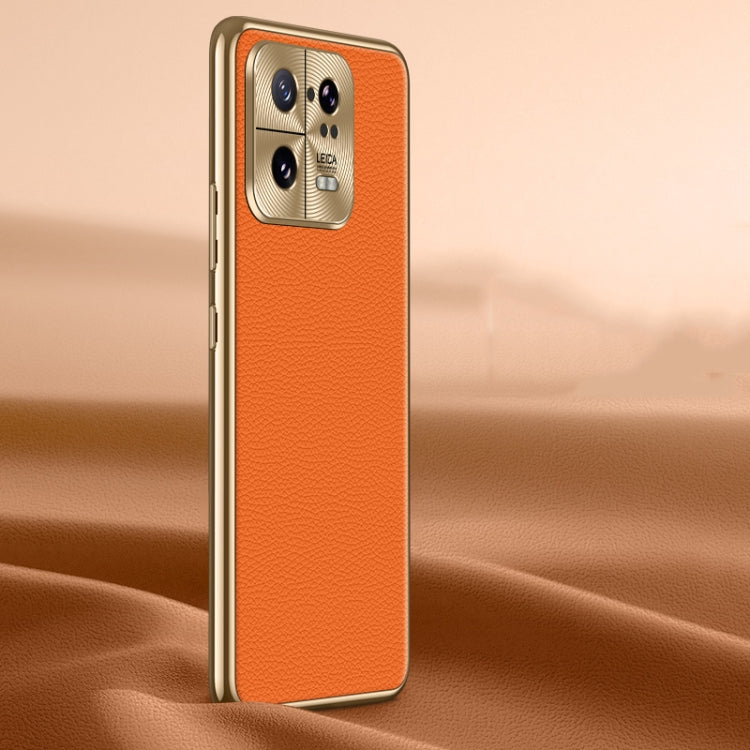 Orange litchi-texture genuine leather phone case with camera cutouts