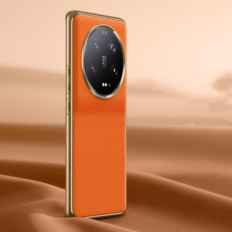 Orange litchi-texture genuine leather phone case, back view with lens cutout.