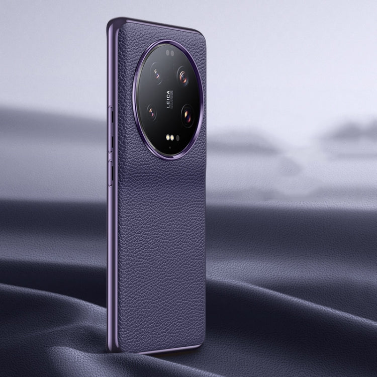 Purple litchi-texture genuine leather phone case with camera cutout, back view.