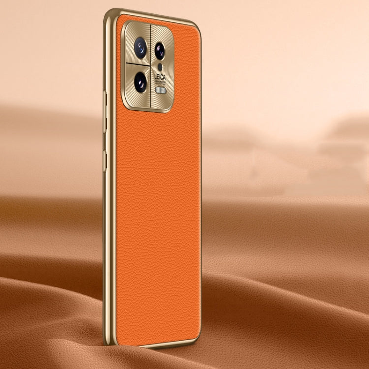 Orange litchi-texture genuine leather phone case with protective camera area