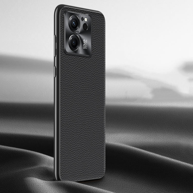 Black litchi-texture genuine leather phone case, back view with camera window.