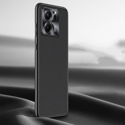 Black litchi-texture genuine leather phone case, back view with camera window.